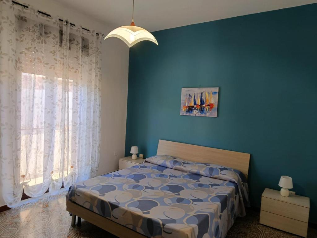 Postel nebo postele na pokoji v ubytování Zá Cicciuzza "Casa vacanza"