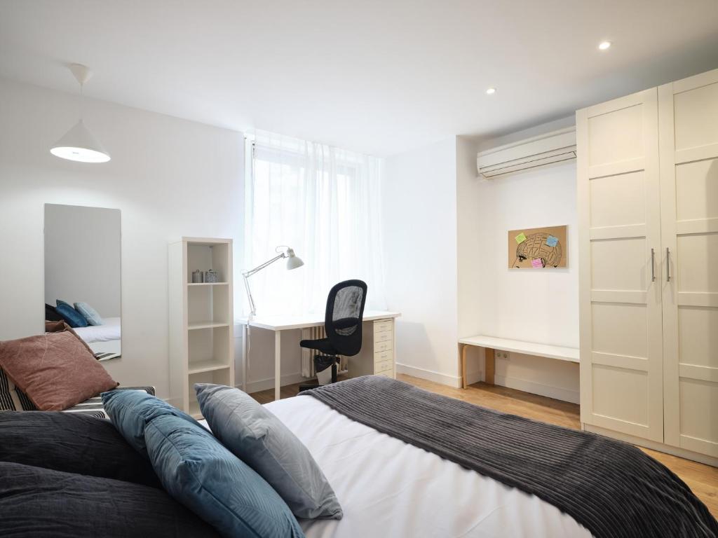 A bed or beds in a room at My City Home - Student Rooms in Moncloa