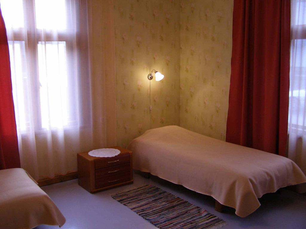 Postel nebo postele na pokoji v ubytování Tiia Guesthouse