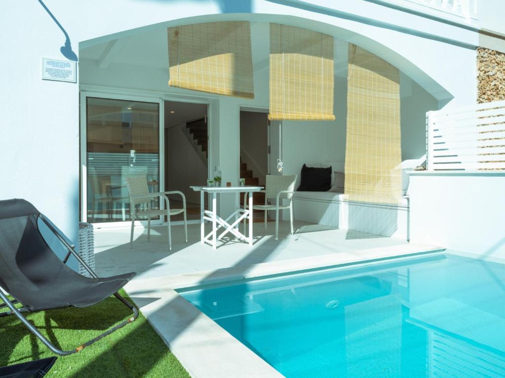 a patio with a pool and a table and chairs at 272 Casa Sol ETV7727 by Mallorca Charme in Can Picafort