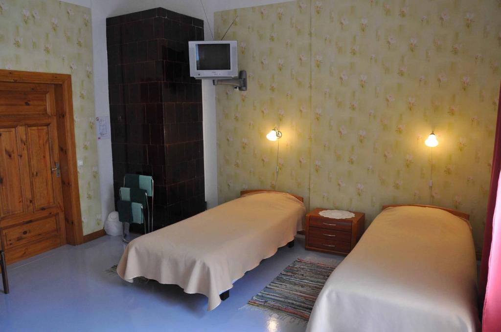 Postel nebo postele na pokoji v ubytování Tiia Guesthouse