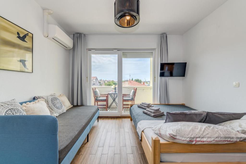 Posteľ alebo postele v izbe v ubytovaní Trogir Downtown Apartments
