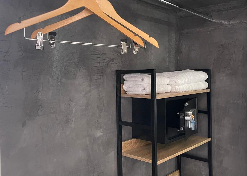 a towel rack in a bathroom with towels at Albatros Hotel in Karterados