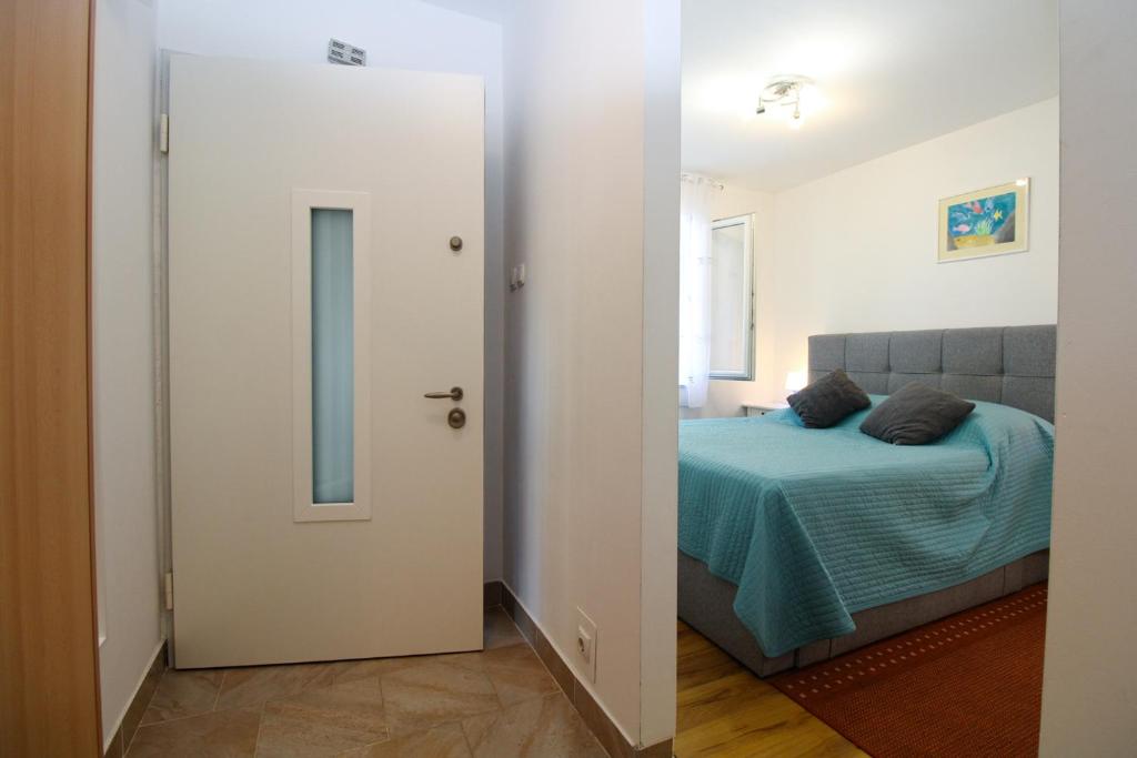 Postel nebo postele na pokoji v ubytování Apartment Marija 1387