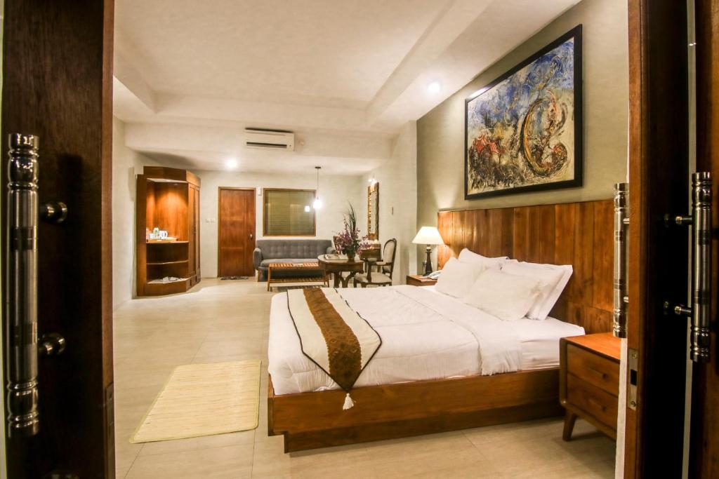 Postel nebo postele na pokoji v ubytování Khanaya Hotel Borobudur
