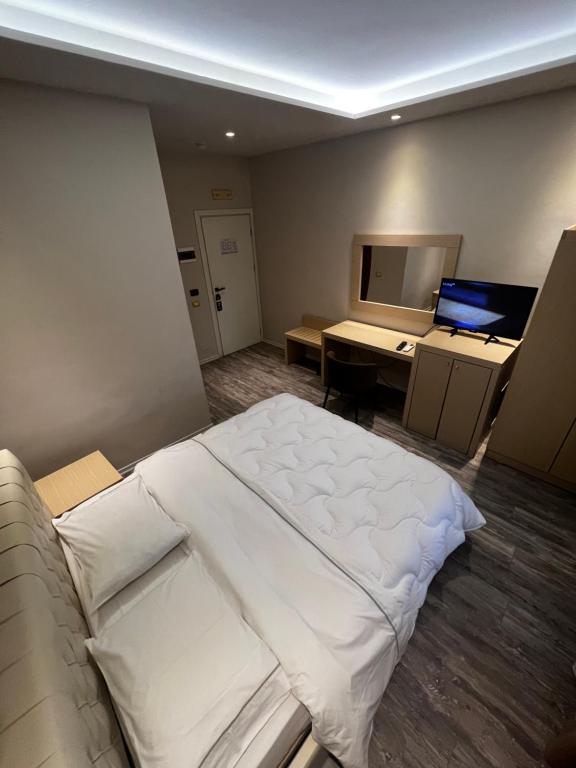 Postel nebo postele na pokoji v ubytování Hotel Lungomare