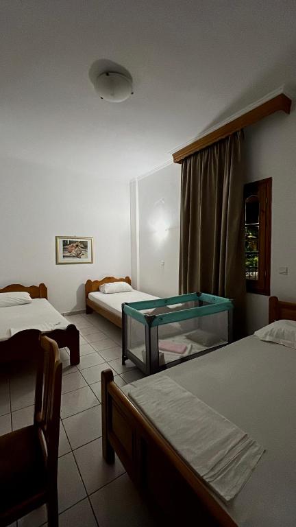 Posteľ alebo postele v izbe v ubytovaní Boufidis Rooms