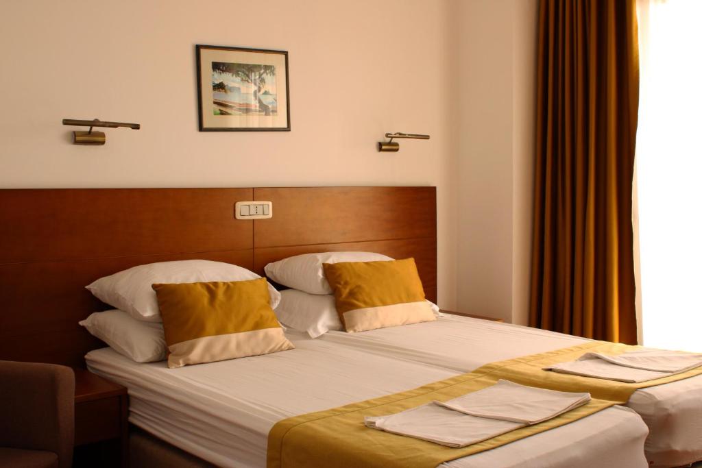 Postel nebo postele na pokoji v ubytování Hotel Petrovac