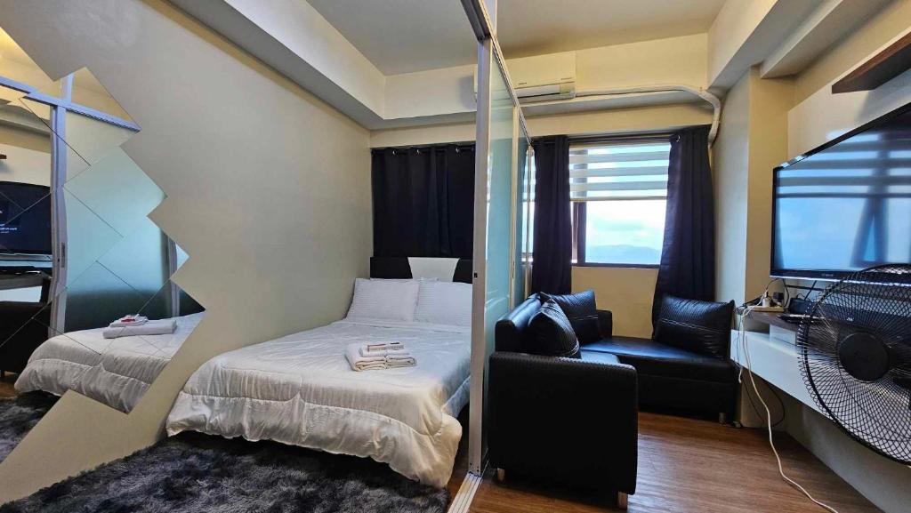Кровать или кровати в номере Nesting Lounge One at Santorini Condotel
