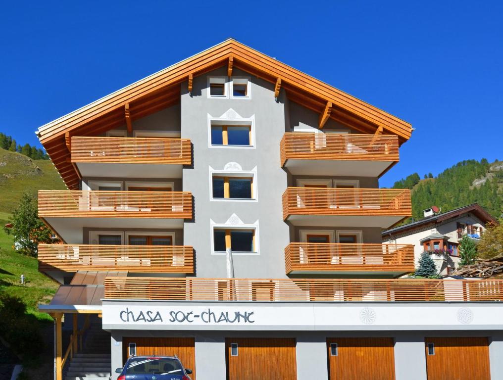 a building with wooden balconies on top of it at Chasa Sot-Chaunt 301 in Samnaun