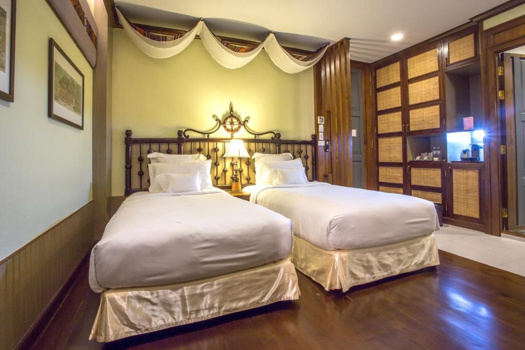 Postel nebo postele na pokoji v ubytování Chankam Boutique Hotel