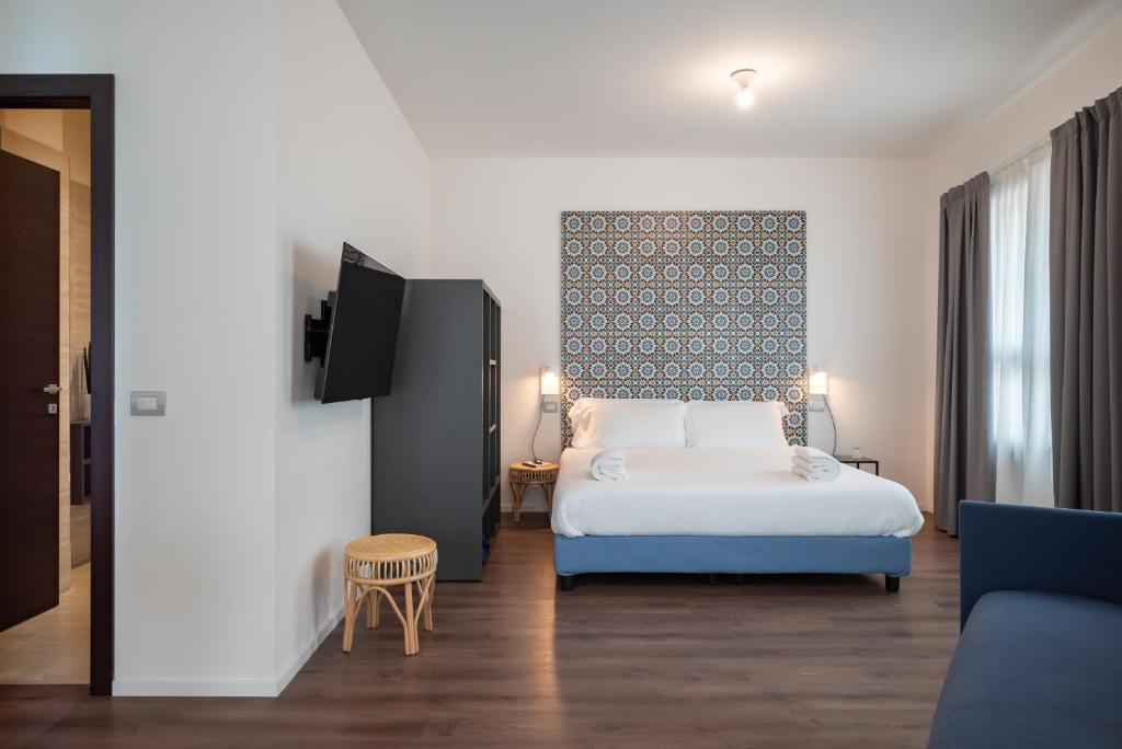 Postel nebo postele na pokoji v ubytování Palazzo Del Porto