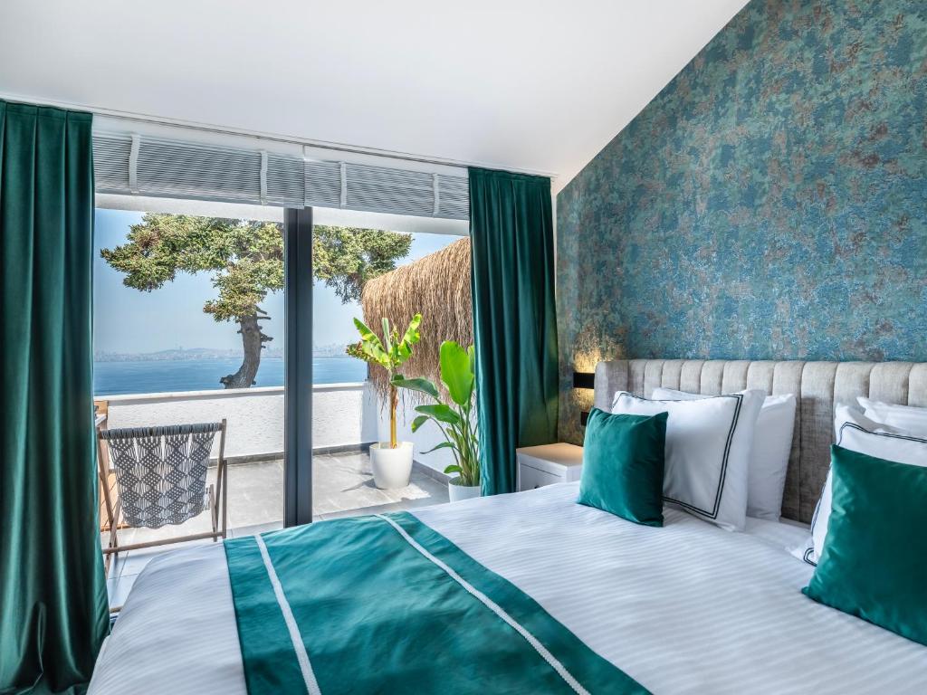 Postel nebo postele na pokoji v ubytování Hillora Hotel Buyukada
