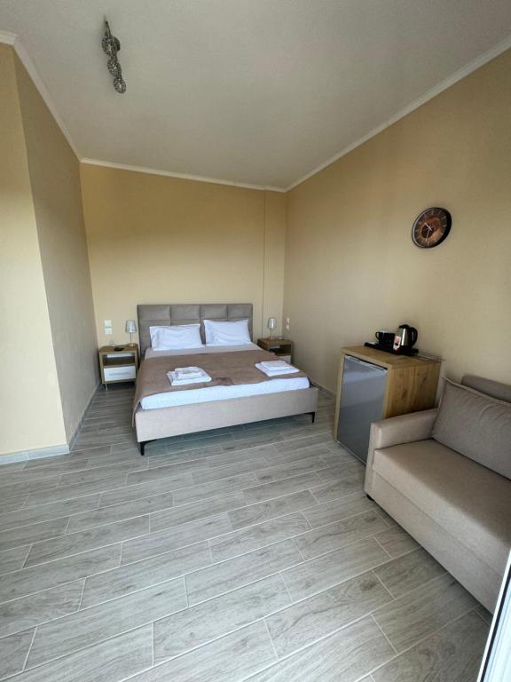 Postel nebo postele na pokoji v ubytování Vila Alexandros
