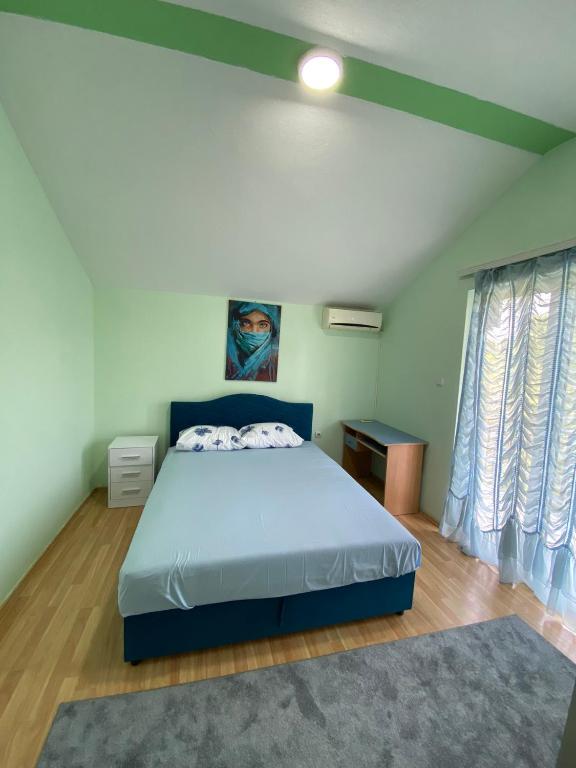 Postel nebo postele na pokoji v ubytování Sneky