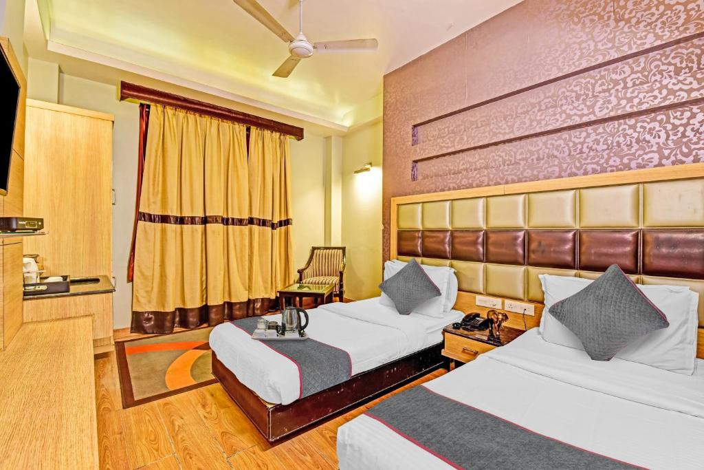 Townhouse 646 Hotel Aroma Residency tesisinde bir odada yatak veya yataklar