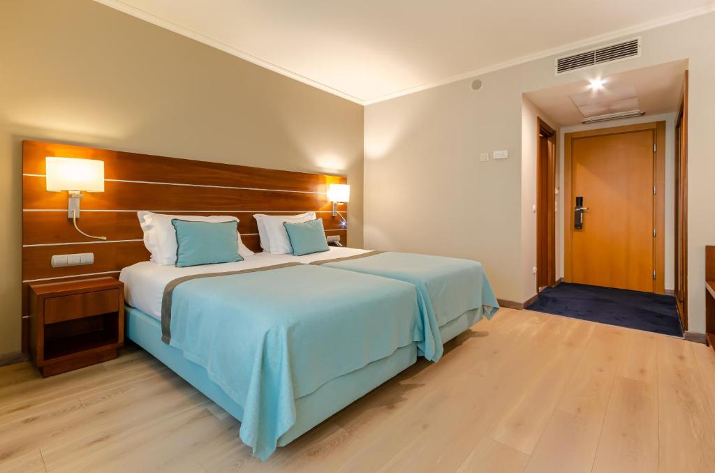 Postel nebo postele na pokoji v ubytování TURIM Europa Hotel