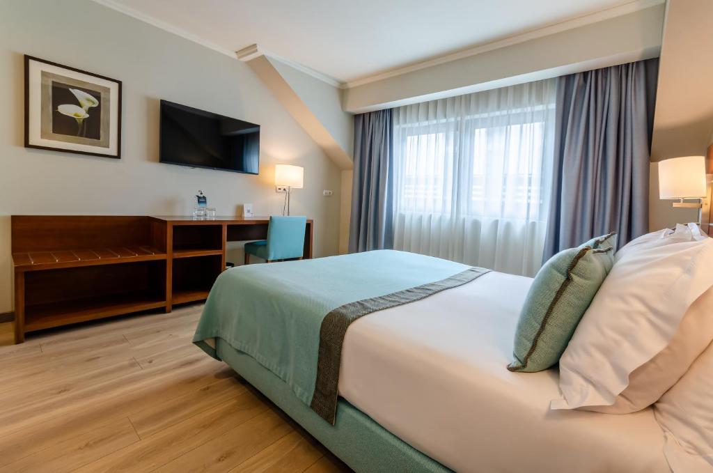 Postel nebo postele na pokoji v ubytování TURIM Europa Hotel
