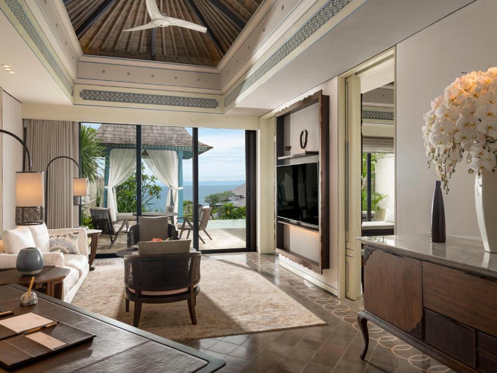 a living room with a couch and a table at Jumeirah Bali in Uluwatu