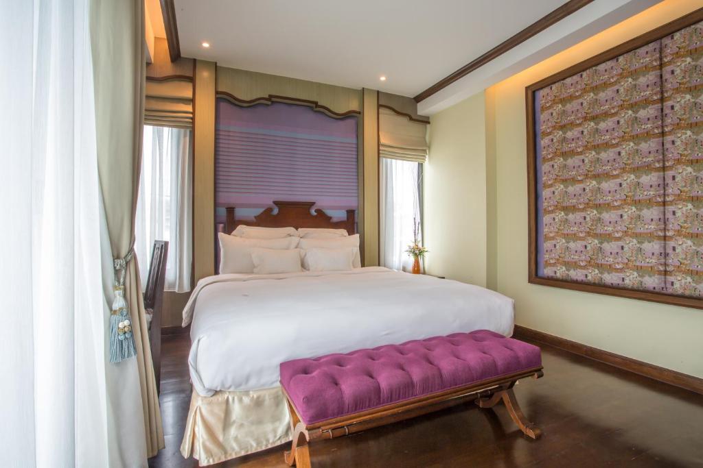 Postel nebo postele na pokoji v ubytování Chankam Boutique Hotel
