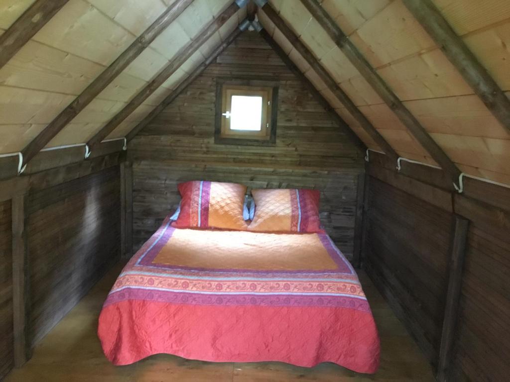 Postel nebo postele na pokoji v ubytování La fricassée