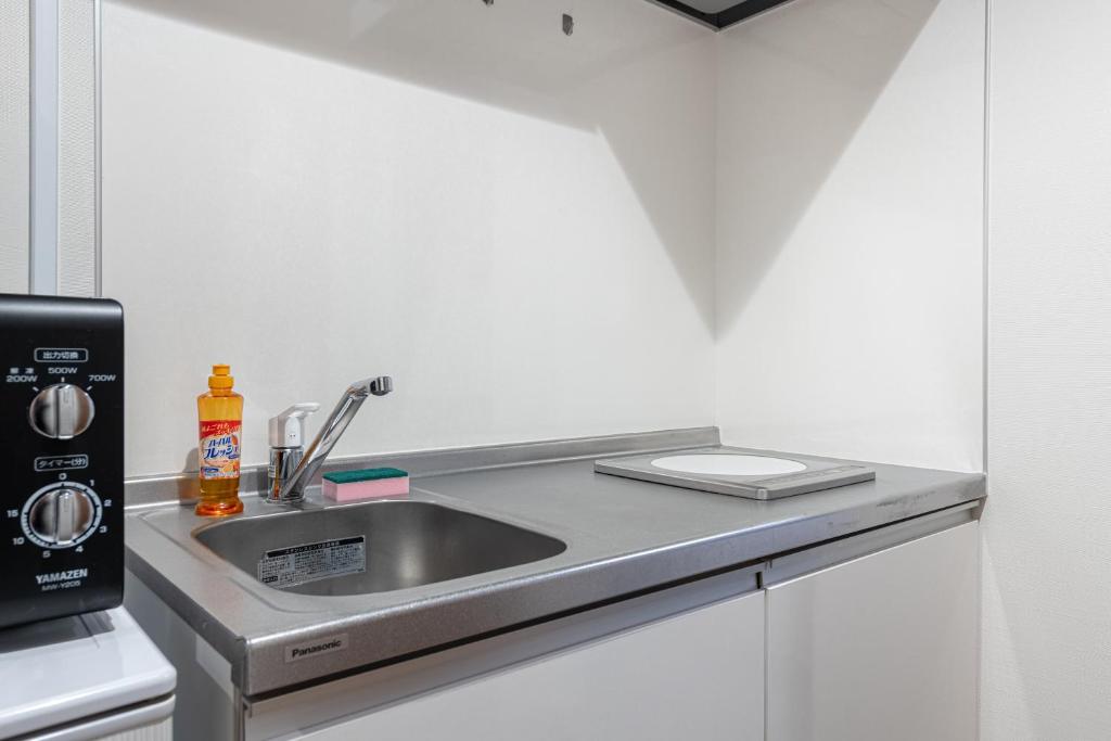 Kuchyň nebo kuchyňský kout v ubytování Komachi Hotel Nipponbashi