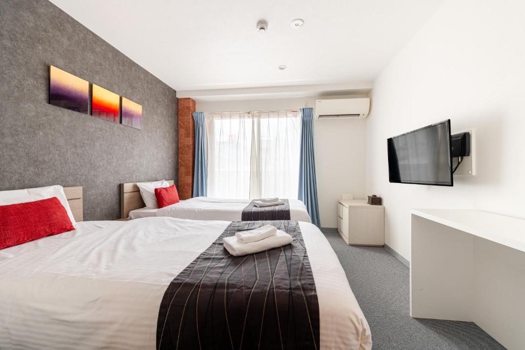 Postel nebo postele na pokoji v ubytování Komachi Hotel Nipponbashi
