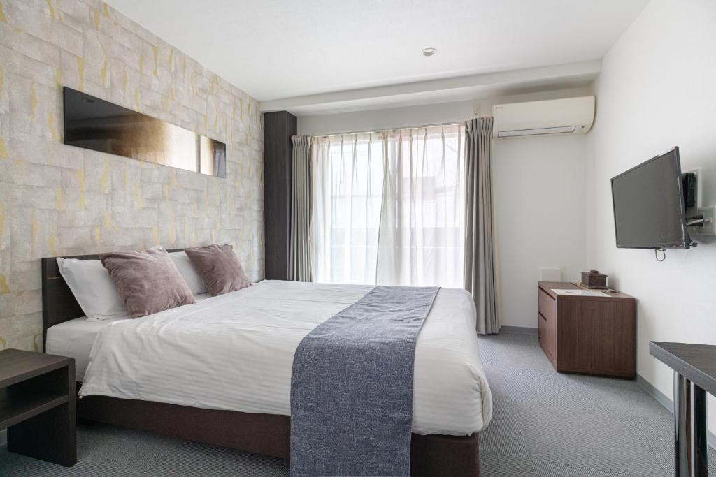 TV a/nebo společenská místnost v ubytování Komachi Hotel Nipponbashi