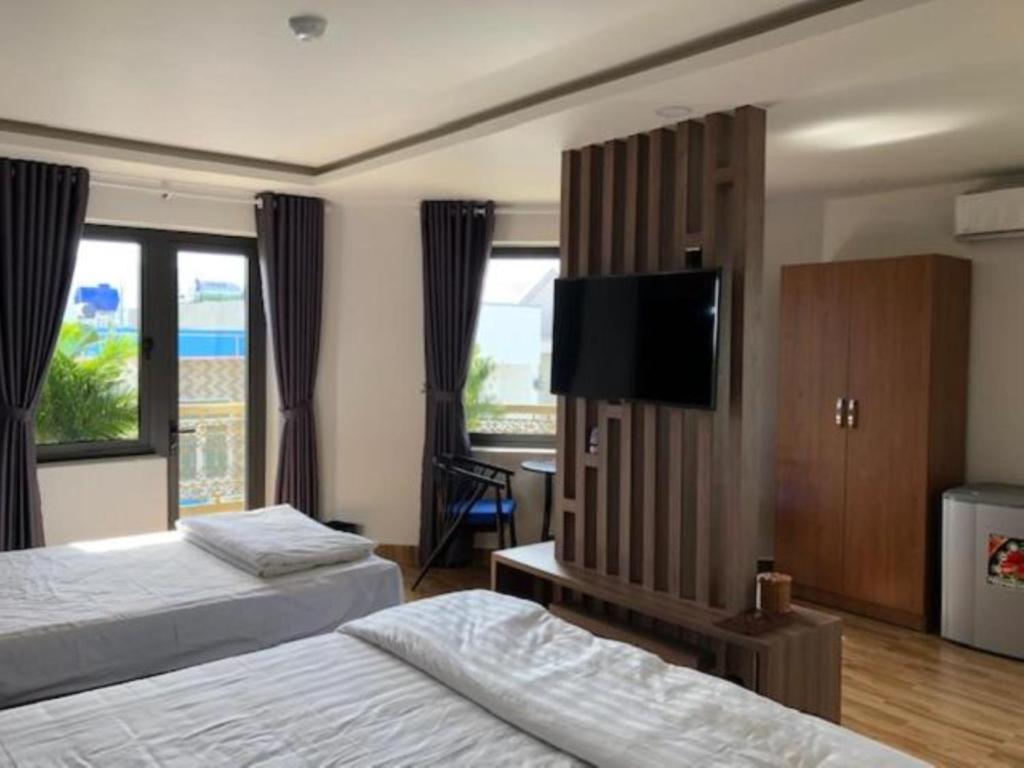 Postel nebo postele na pokoji v ubytování HOÀNG SA HOTEL