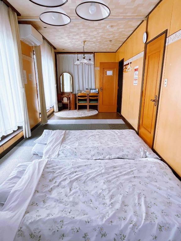 Postel nebo postele na pokoji v ubytování T&T Fujiyama Guest House