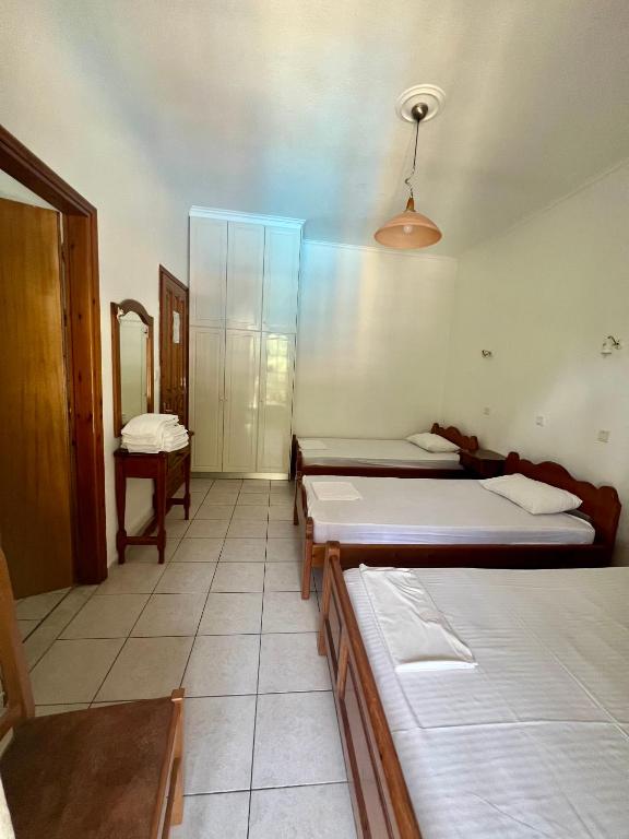Posteľ alebo postele v izbe v ubytovaní Boufidis Rooms