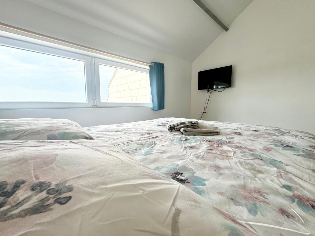 Кровать или кровати в номере L'Opaline - Vue mer