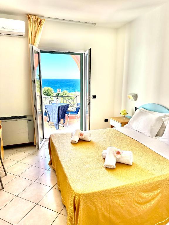 Postel nebo postele na pokoji v ubytování Hotel Alizé