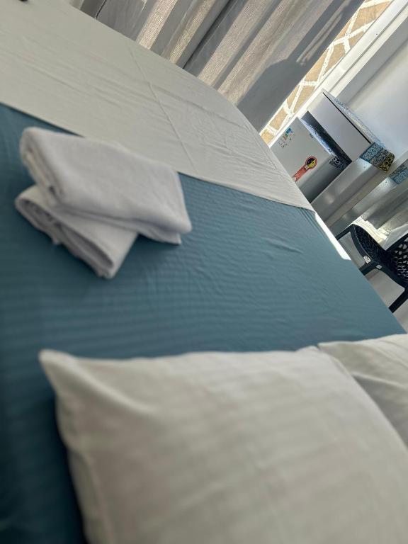 Postel nebo postele na pokoji v ubytování Praia dos Anjos Suítes
