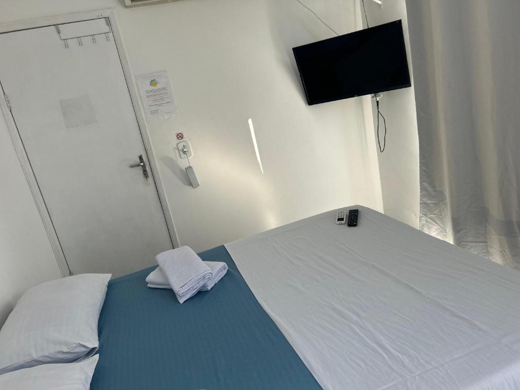 Postel nebo postele na pokoji v ubytování Praia dos Anjos Suítes
