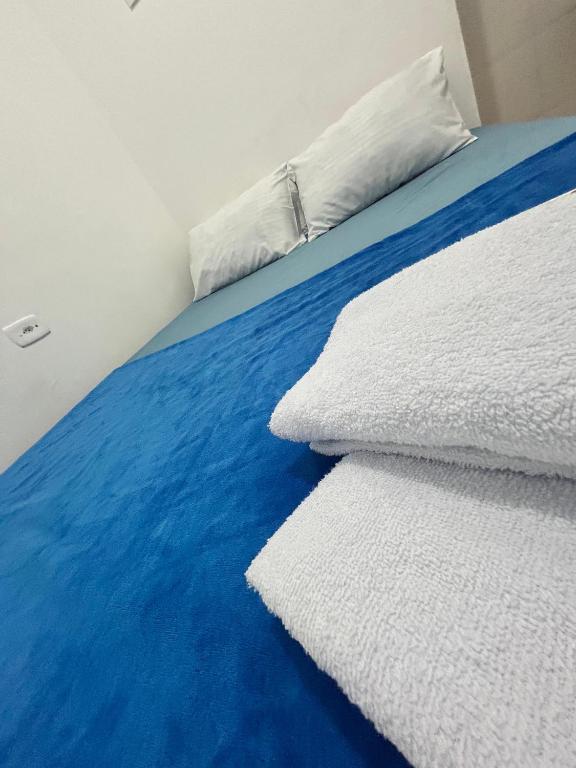 Postel nebo postele na pokoji v ubytování Praia dos Anjos Suítes