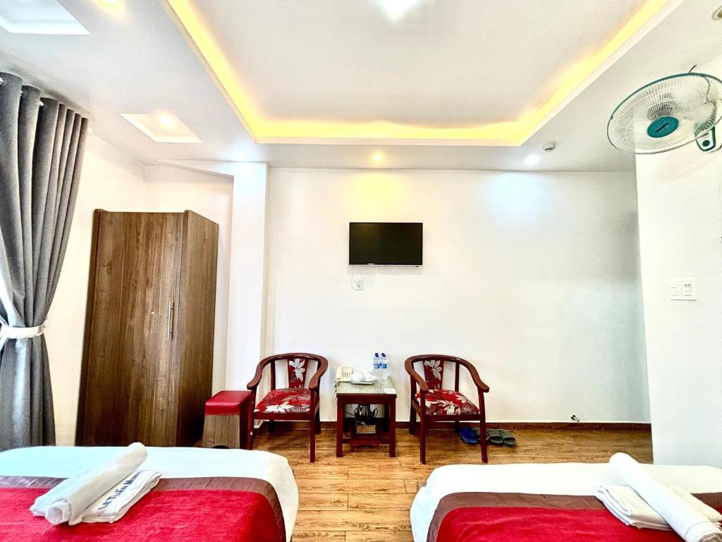 Postel nebo postele na pokoji v ubytování Le Tuan Minh Hotel