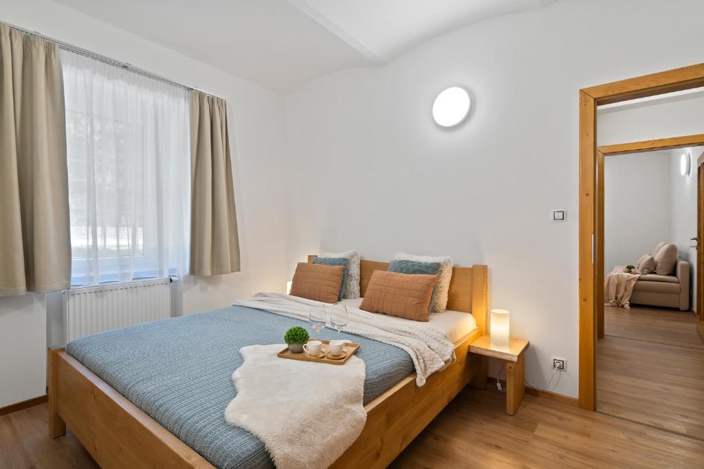 Ένα ή περισσότερα κρεβάτια σε δωμάτιο στο Špindl Lodge Apartments Self check-in & Sauna