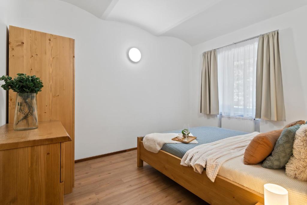 Ένα ή περισσότερα κρεβάτια σε δωμάτιο στο Špindl Lodge Apartments Self check-in & Sauna
