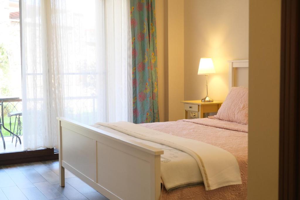 Postel nebo postele na pokoji v ubytování Nilüfer Butik Otel