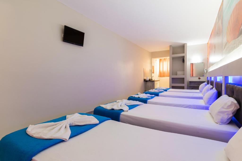 Postel nebo postele na pokoji v ubytování Savvas Hotel