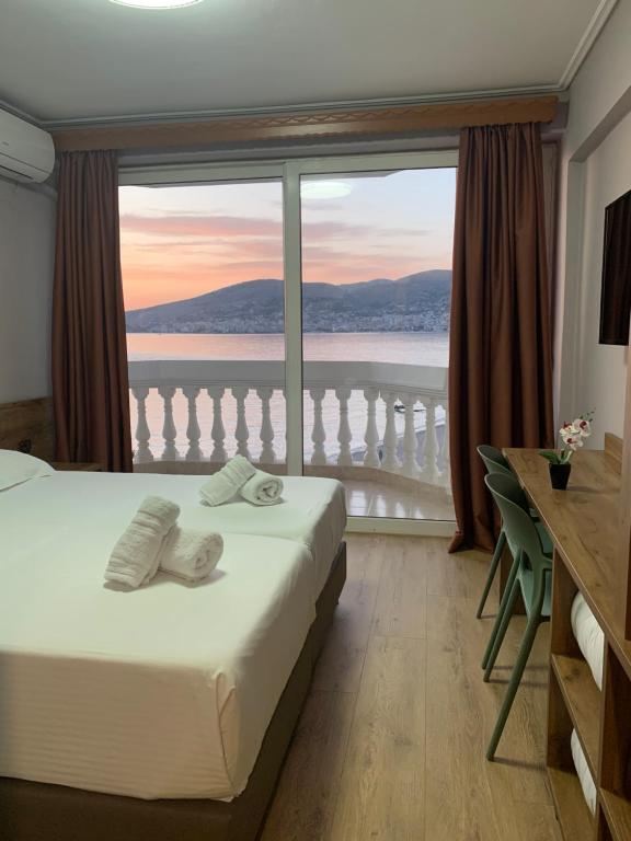 Giường trong phòng chung tại Hotel Dodona