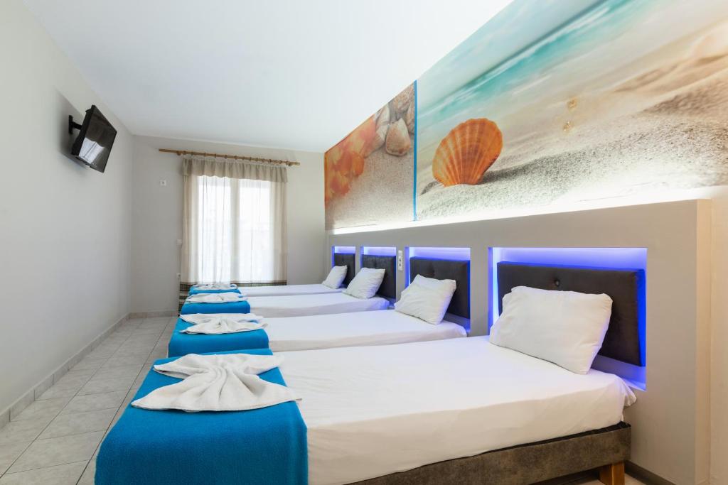 Postel nebo postele na pokoji v ubytování Savvas Hotel