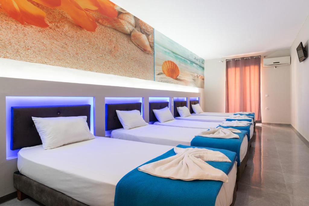 Postel nebo postele na pokoji v ubytování Savvas Hotel