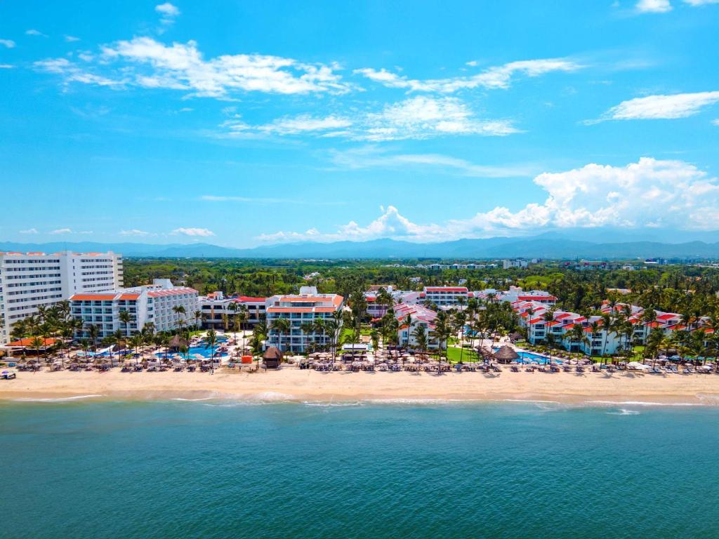 an aerial view of a beach with a resort at Marival Emotions Resort & Suites Riviera Nayarit by Mercure in Nuevo Vallarta