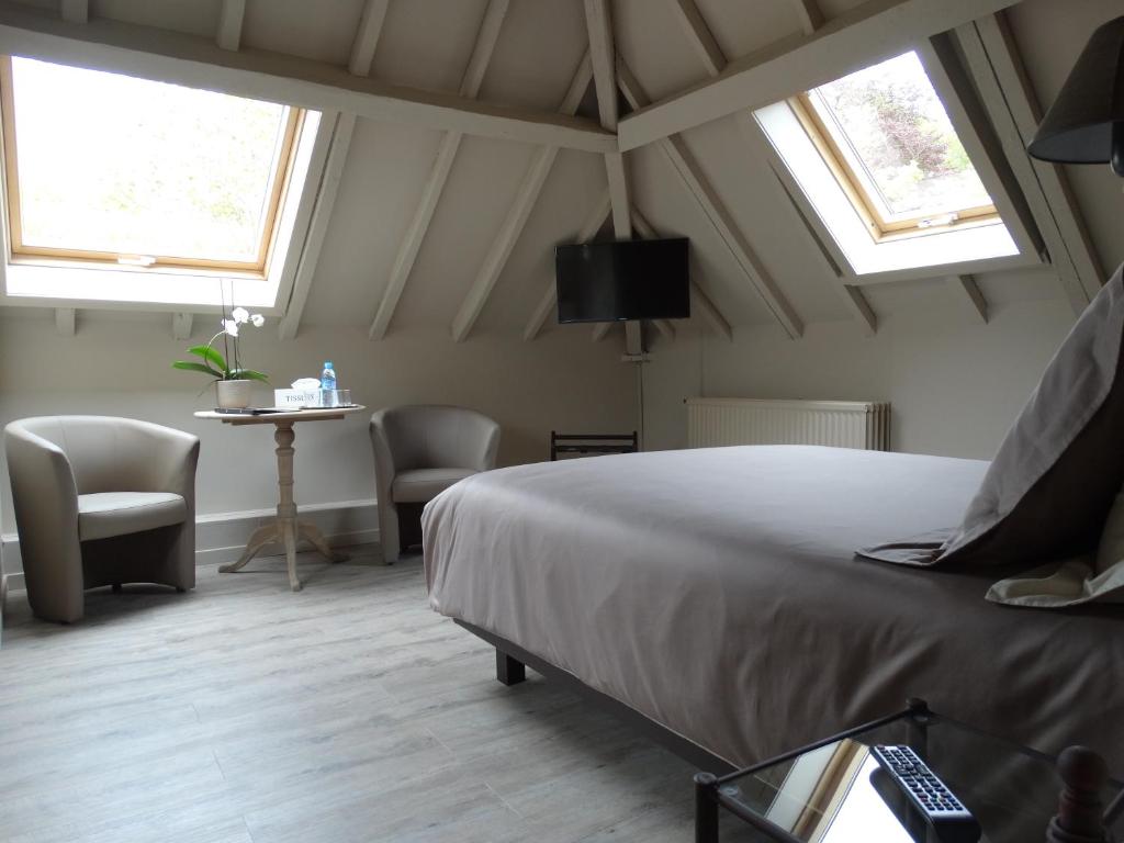 En eller flere senge i et værelse på B&B Castel 't Haantje