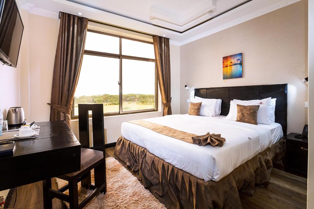 Postel nebo postele na pokoji v ubytování The Nest Boutique Hotel