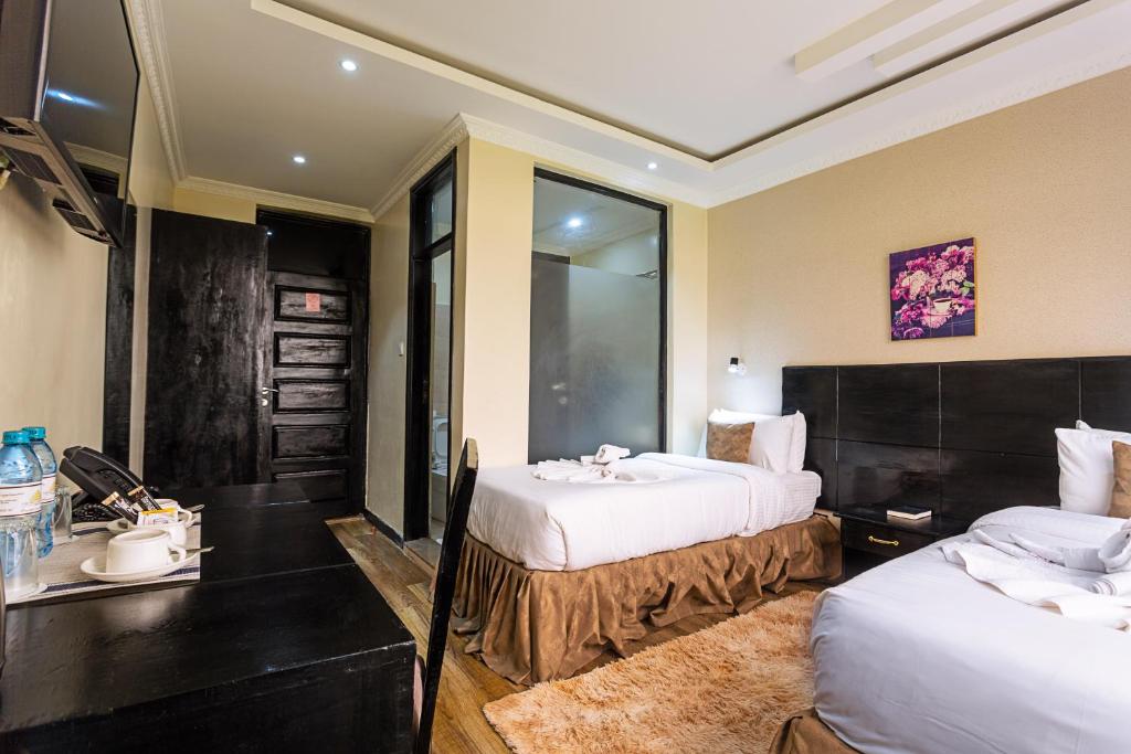 Postel nebo postele na pokoji v ubytování The Nest Boutique Hotel