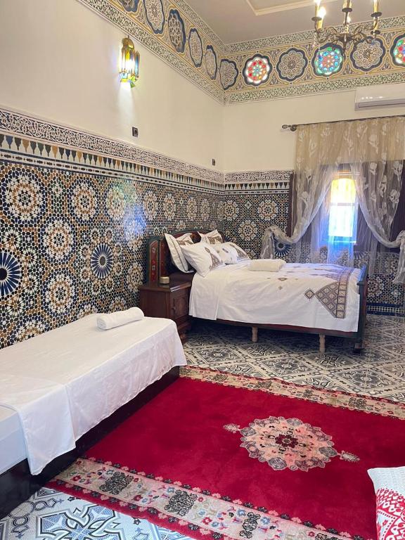 Postel nebo postele na pokoji v ubytování Riad Blue Oasis