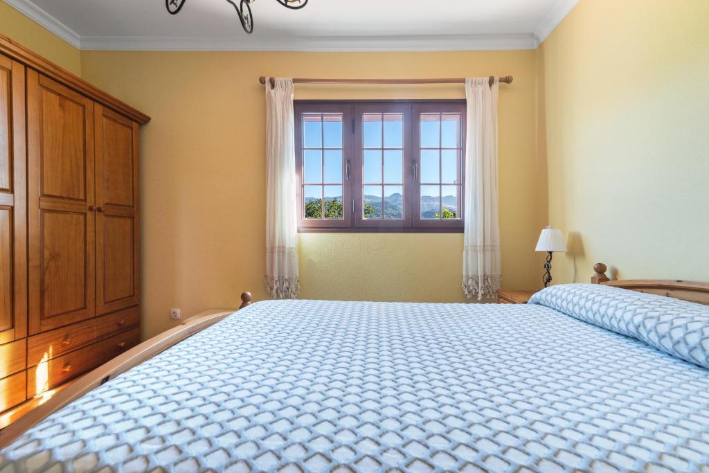 A bed or beds in a room at Villa Arrebol Azul